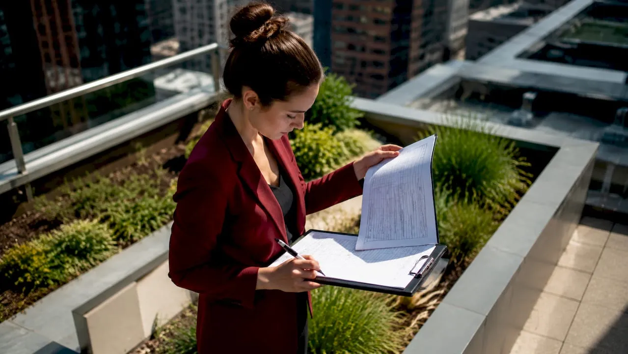 Transport analyst reviewing paper surveys and inputting data