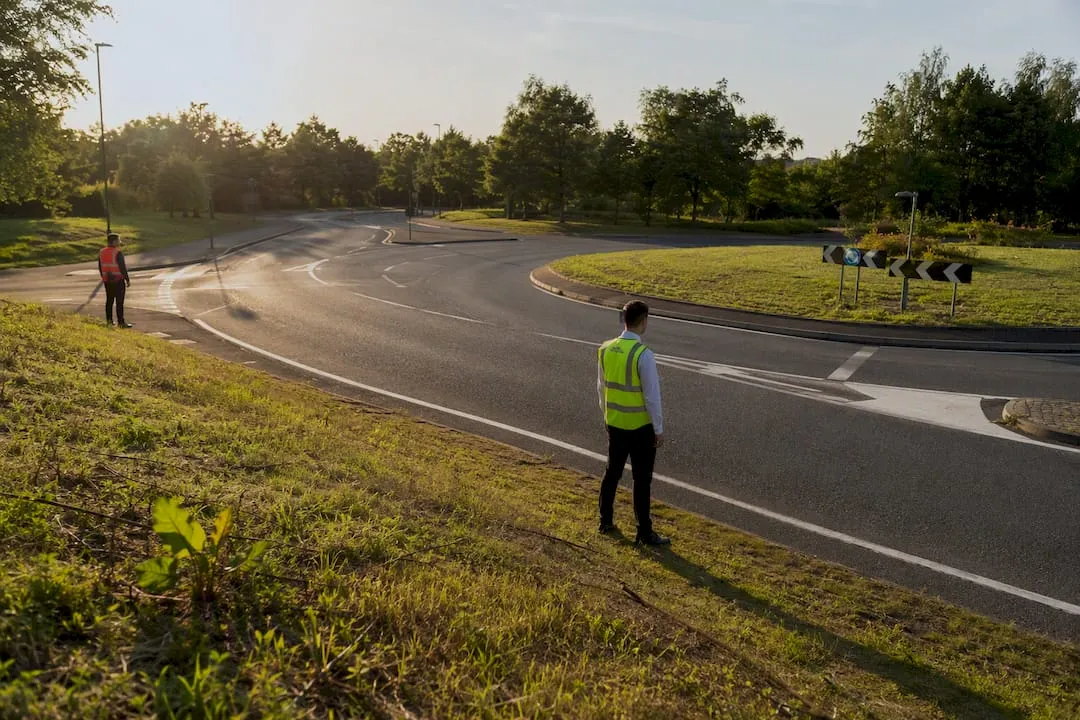 Engineer assessing hazards at a suburban roundabout