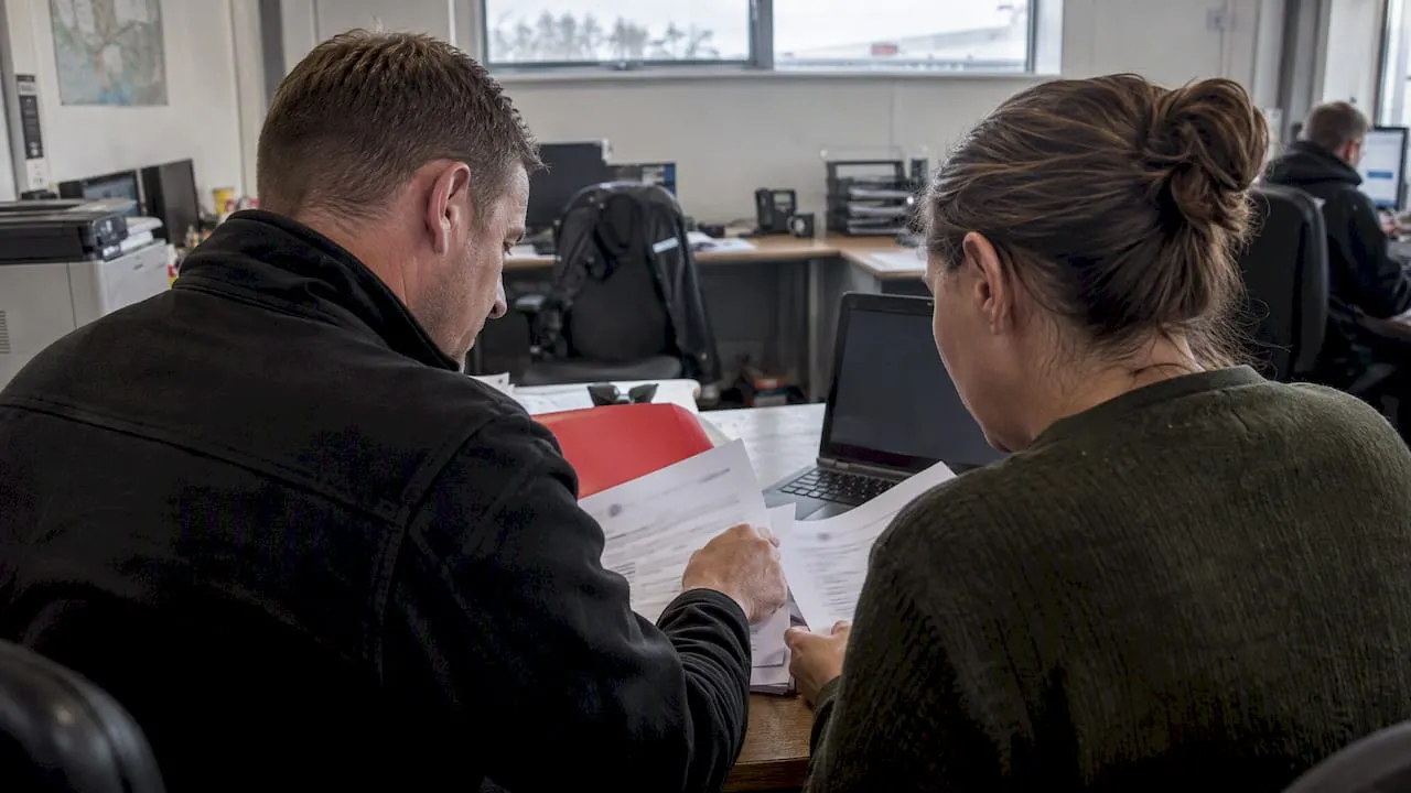 Hiring manager reviewing transport scheduler candidates